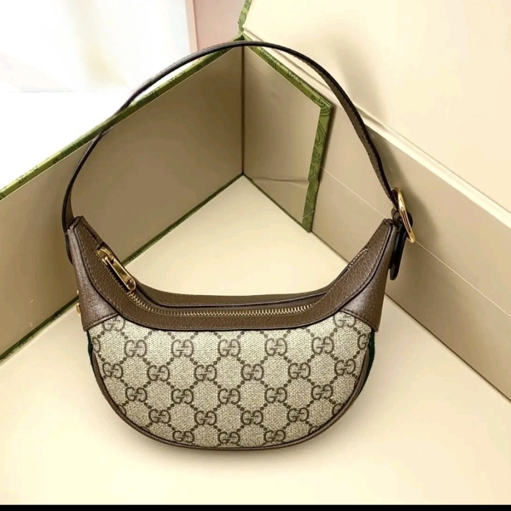 GG Supreme Monogram Textured Calfskin Web Mini Ophidia Half Moon Hobo Bag.